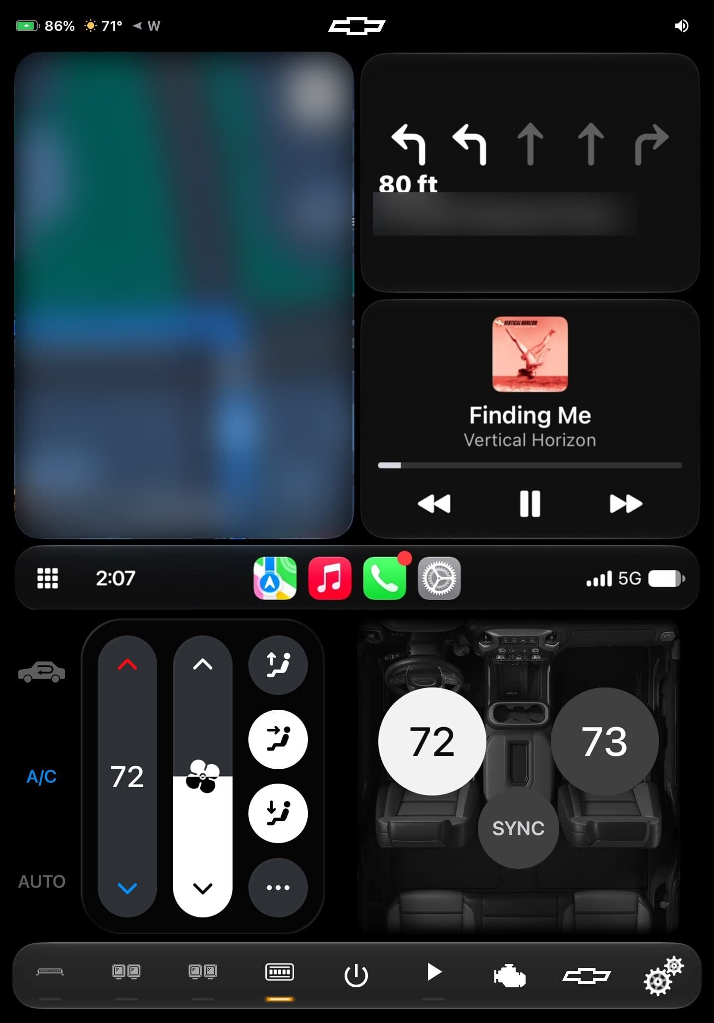 The truck's head unit: CarPlay navigation and music on top, climate controls with dual-zone temperatures below